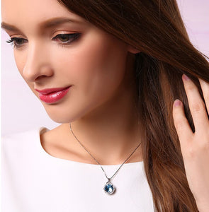 CDE 925 sterling silver necklace embellished with Swarovski crystals blue circle pendant