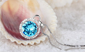 CDE 925 sterling silver necklace embellished with Swarovski crystals blue circle pendant