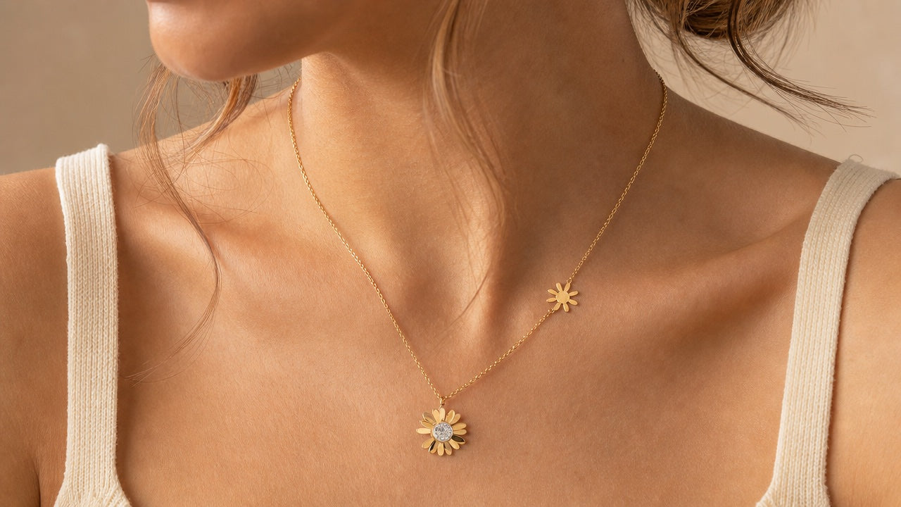 Gold sunflower pendant necklace worn on a neck
